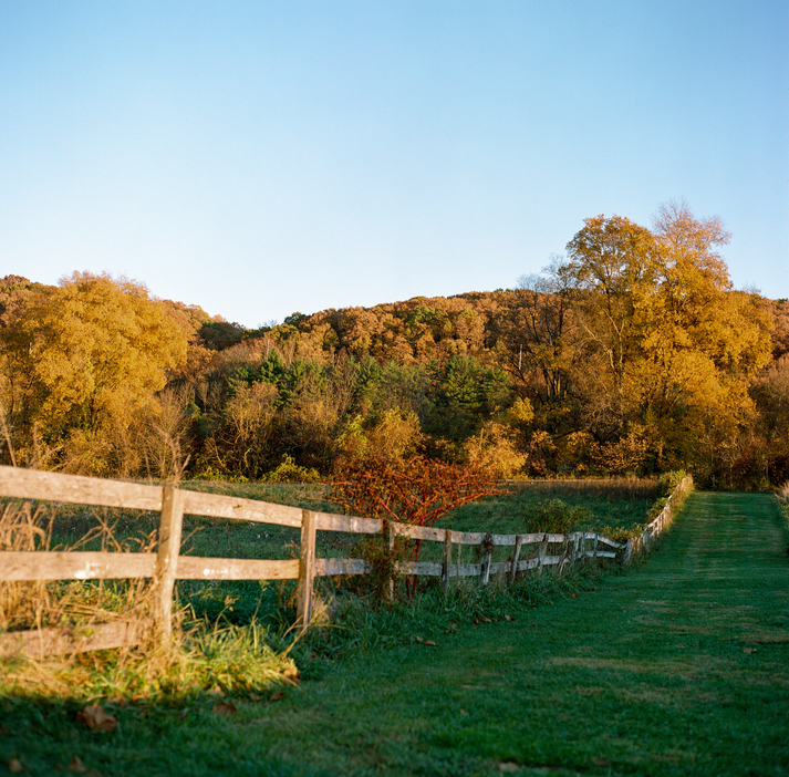 Fence In Disrepair At Sunset On An Autumn Evening.